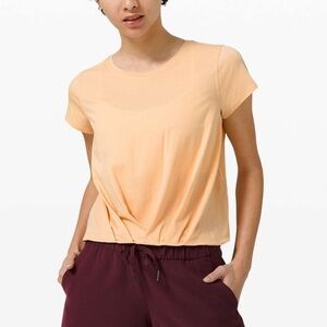 Lululemon Pleats and Thank You Short Sleeve in Ivory Peach
Size 6